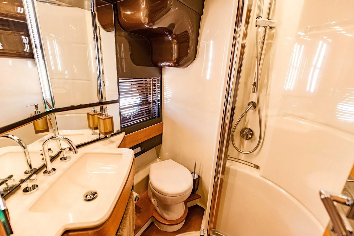 a bathroom with a toilet and sink aboard SYLVIA VI Yacht for Sale