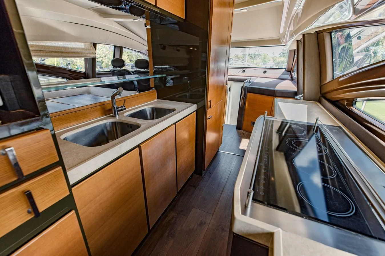 a kitchen with a sink and cabinets aboard SYLVIA VI Yacht for Sale
