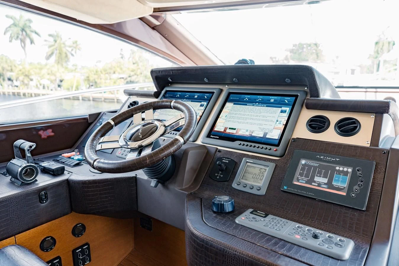 a console with a screen and remote controls aboard SYLVIA VI Yacht for Sale