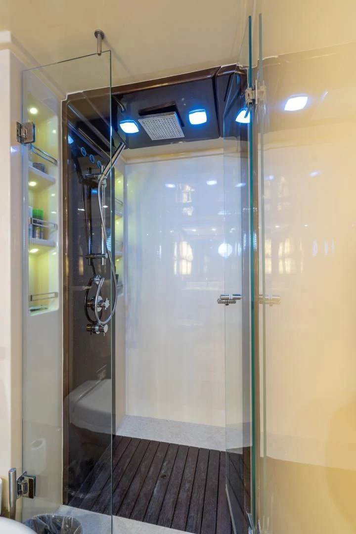 a bathroom with a glass shower aboard SYLVIA VI Yacht for Sale