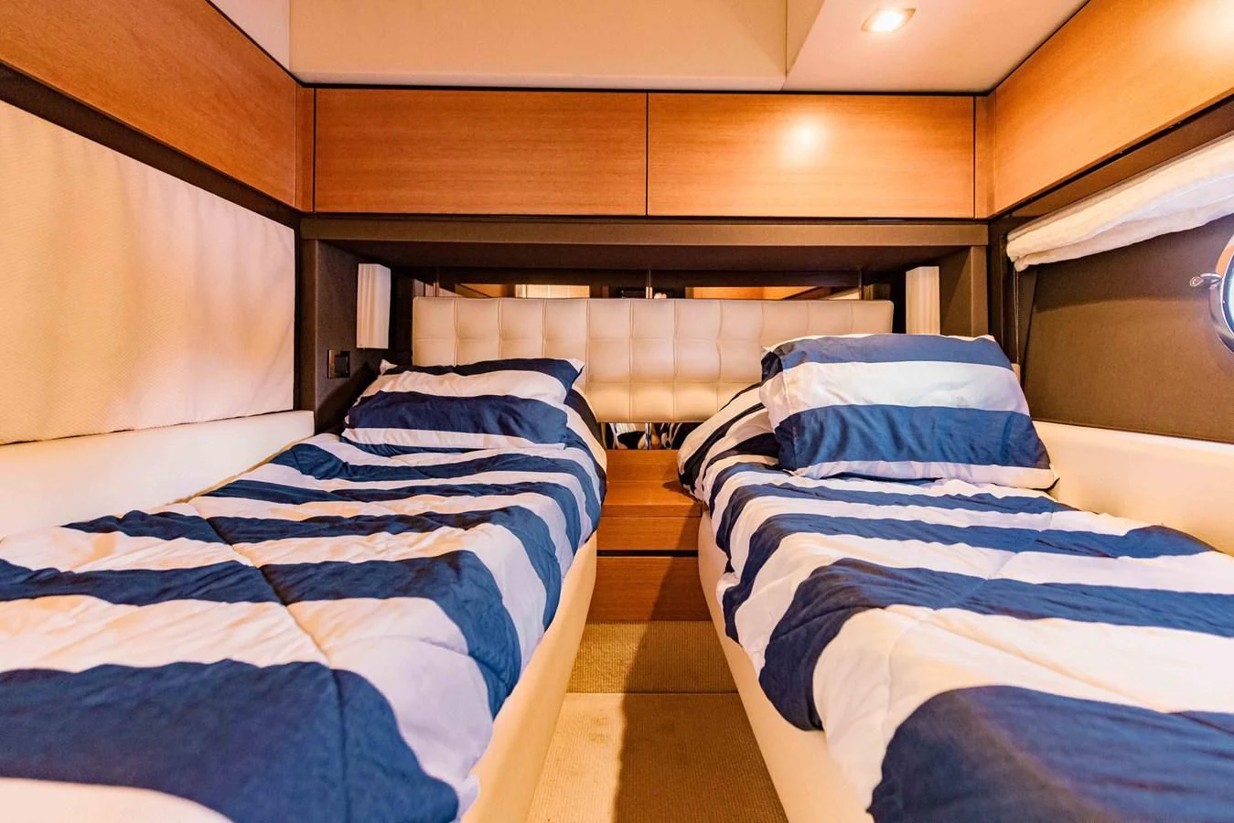 a couple of beds in a room aboard SYLVIA VI Yacht for Sale