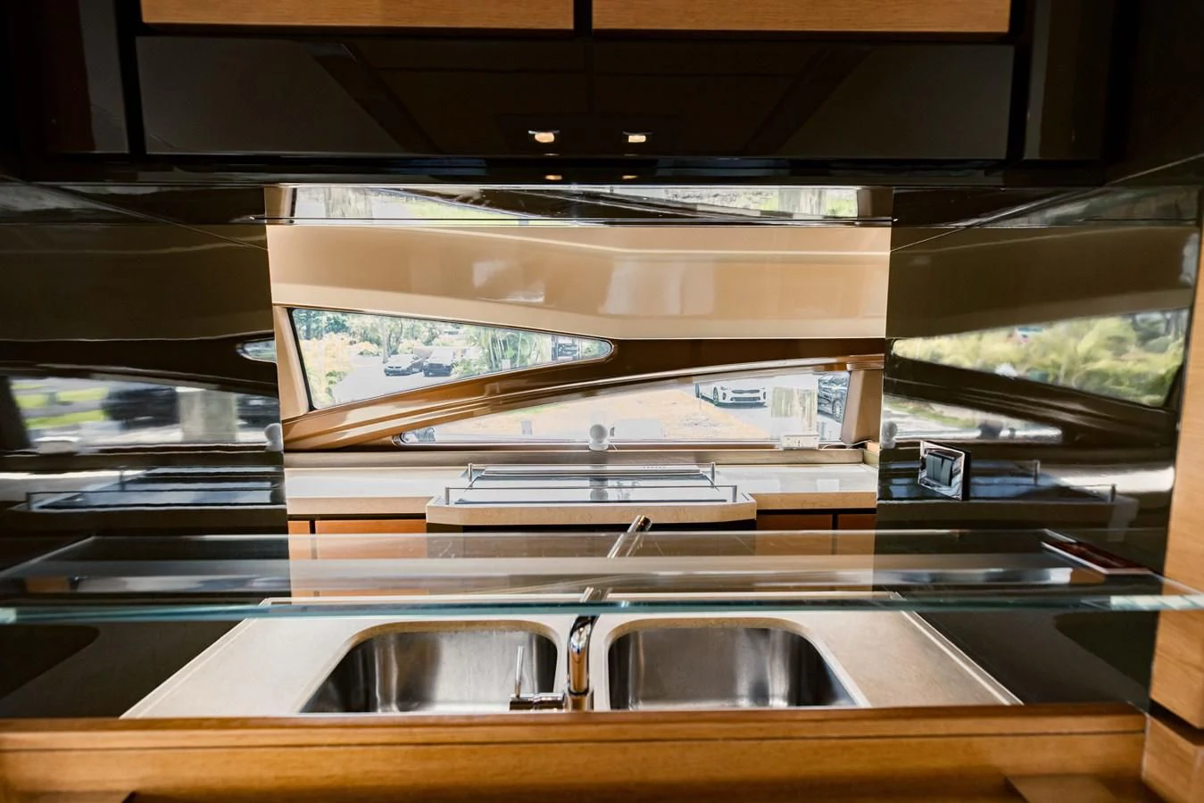 a shelf with a sink and a mirror aboard SYLVIA VI Yacht for Sale