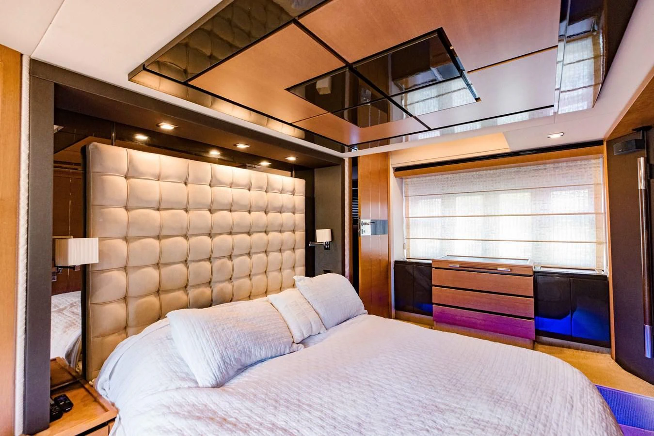 a bed with a large bed aboard SYLVIA VI Yacht for Sale