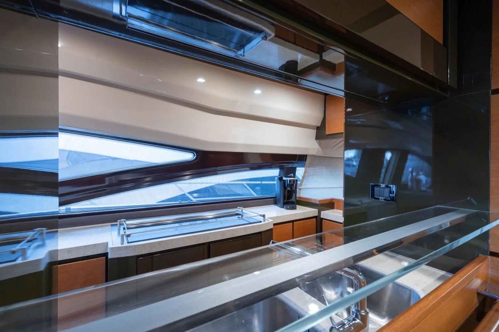 a large room with glass walls aboard SYLVIA VI Yacht for Sale