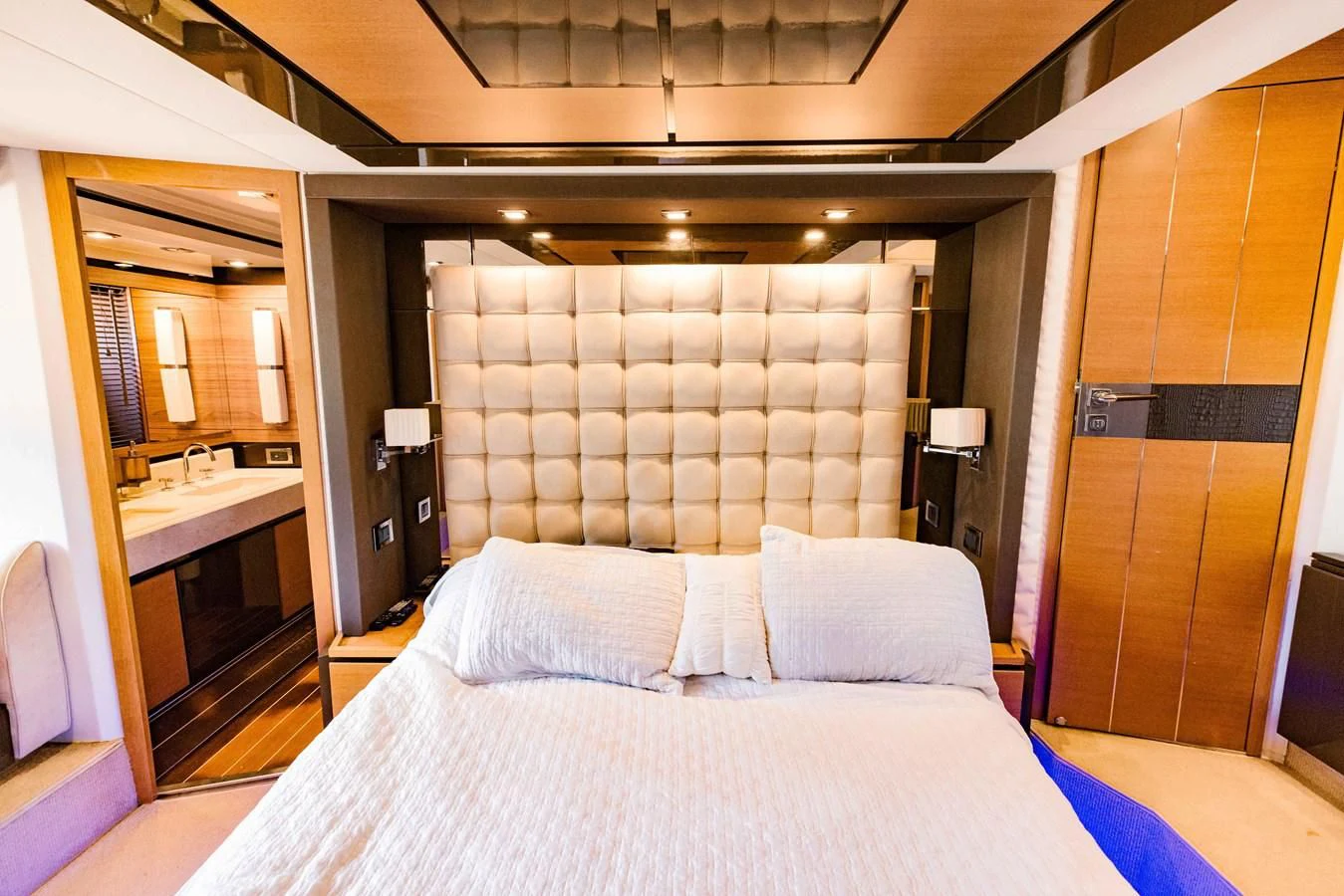 a bed with a white sheet aboard SYLVIA VI Yacht for Sale
