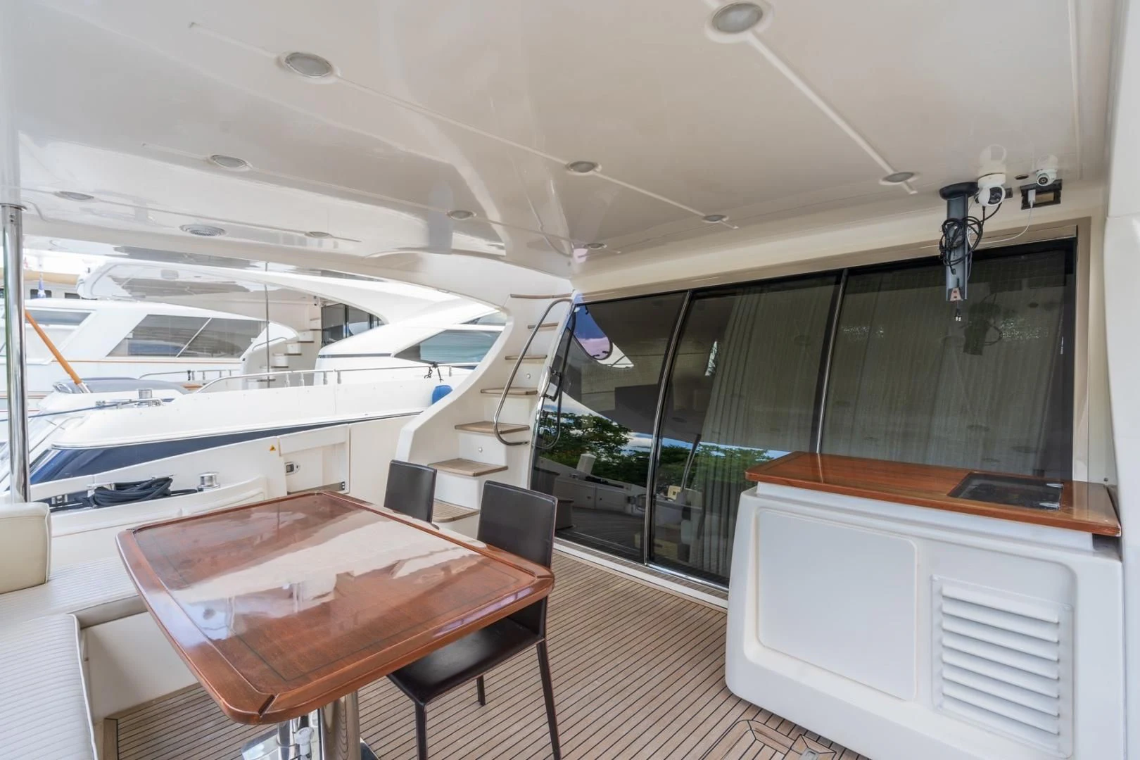 a room with a table and chairs aboard SYLVIA VI Yacht for Sale