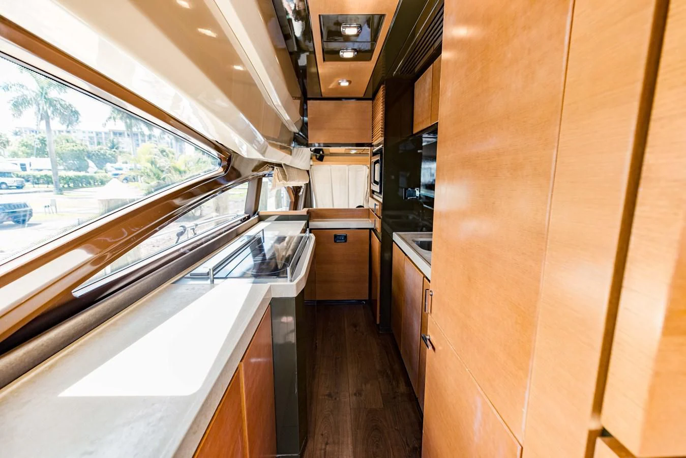 a kitchen with a large window aboard SYLVIA VI Yacht for Sale
