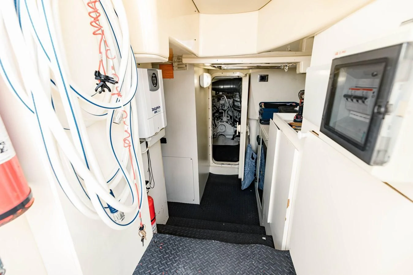 a room with a blue rug and a white wall with a blue rug aboard SYLVIA VI Yacht for Sale