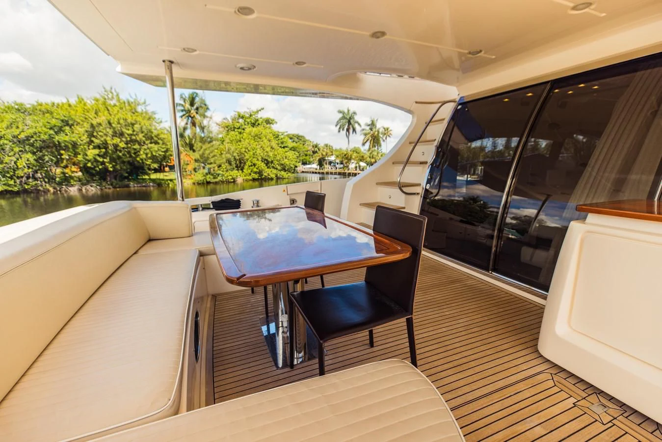 a table and chairs on a deck aboard SYLVIA VI Yacht for Sale