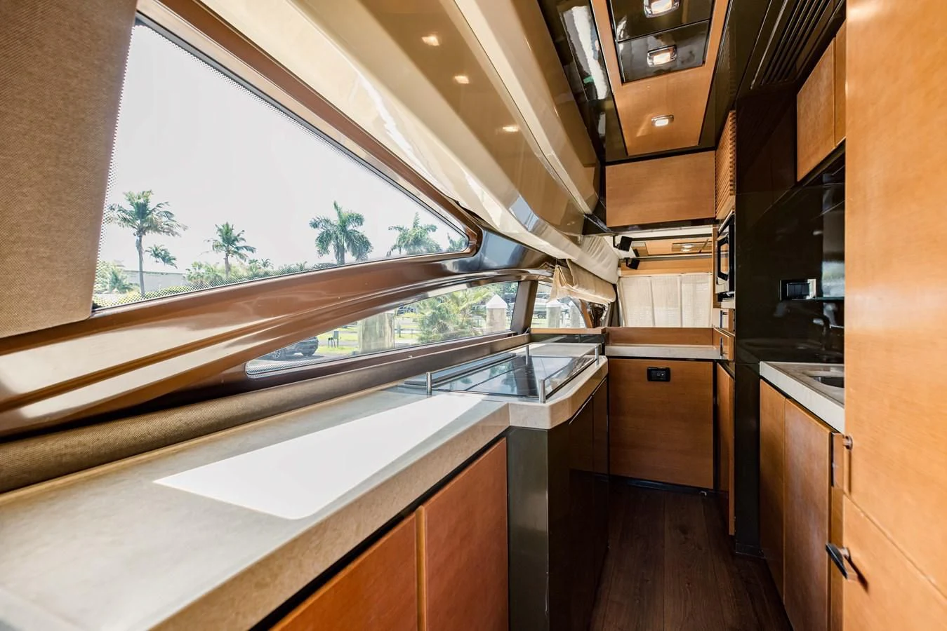a kitchen with a large window aboard SYLVIA VI Yacht for Sale