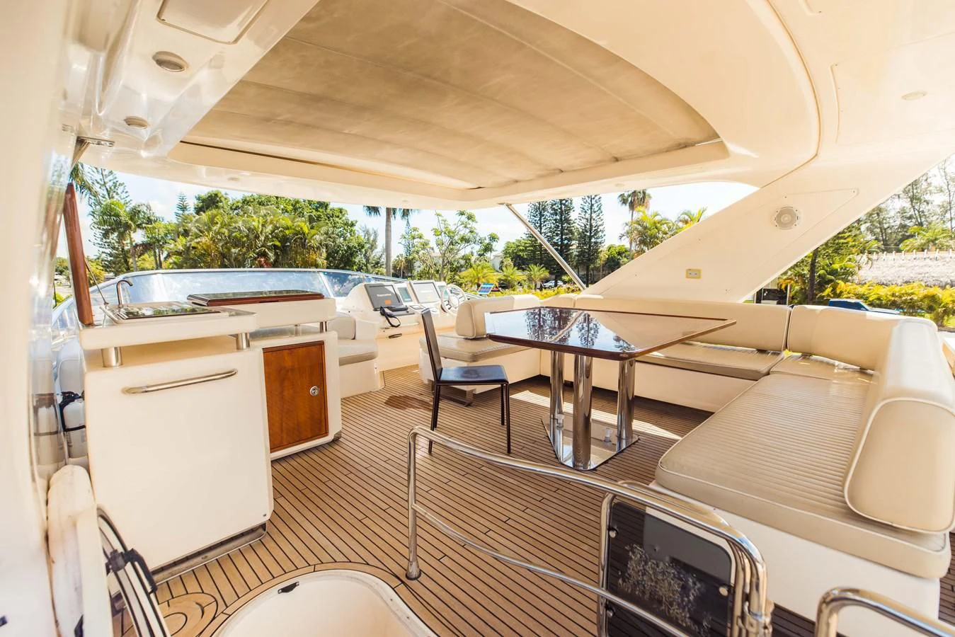 a room with a table and chairs aboard SYLVIA VI Yacht for Sale