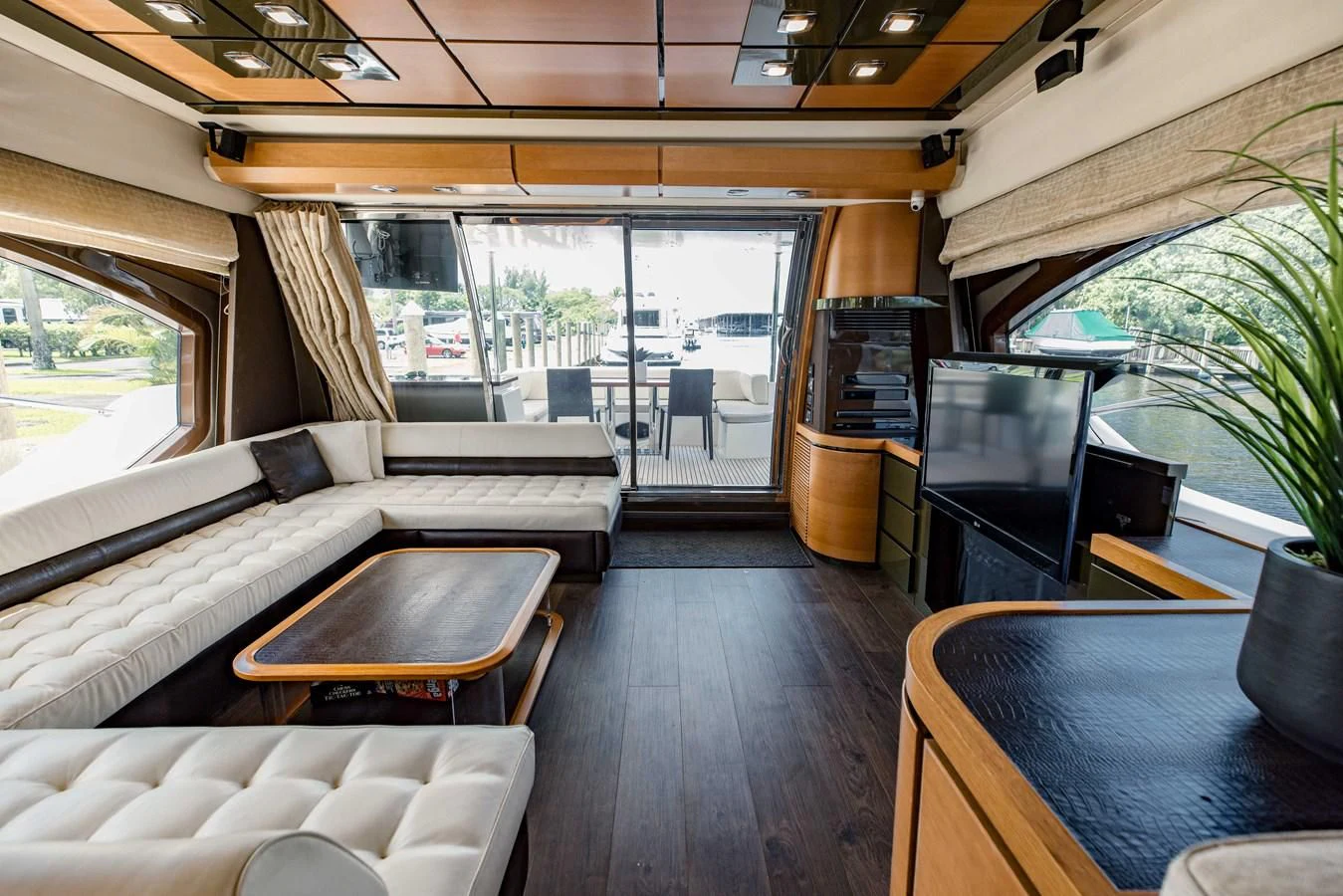 a room with a couch and a tv aboard SYLVIA VI Yacht for Sale
