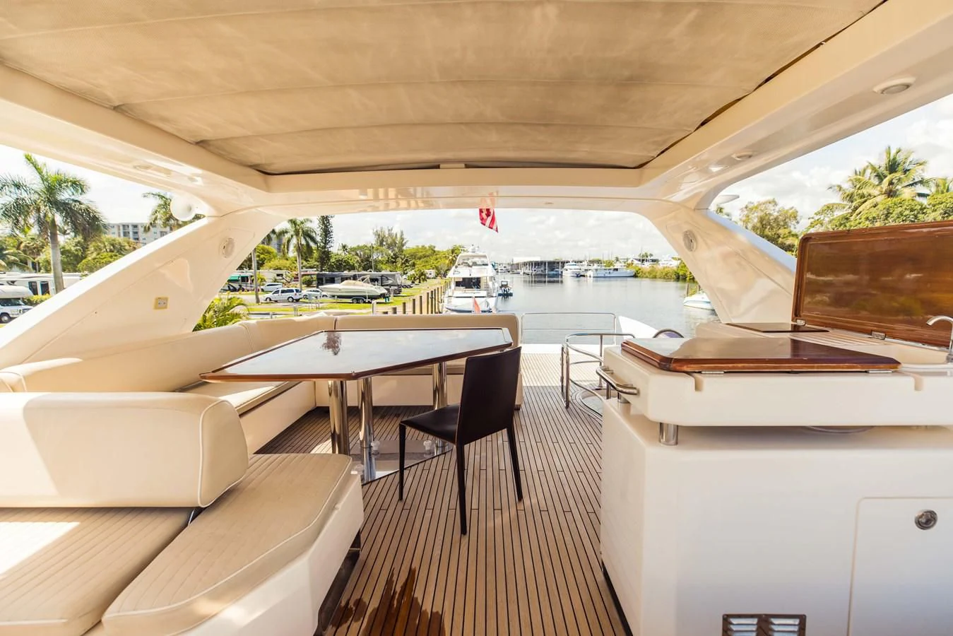 a room with a table and chairs aboard SYLVIA VI Yacht for Sale