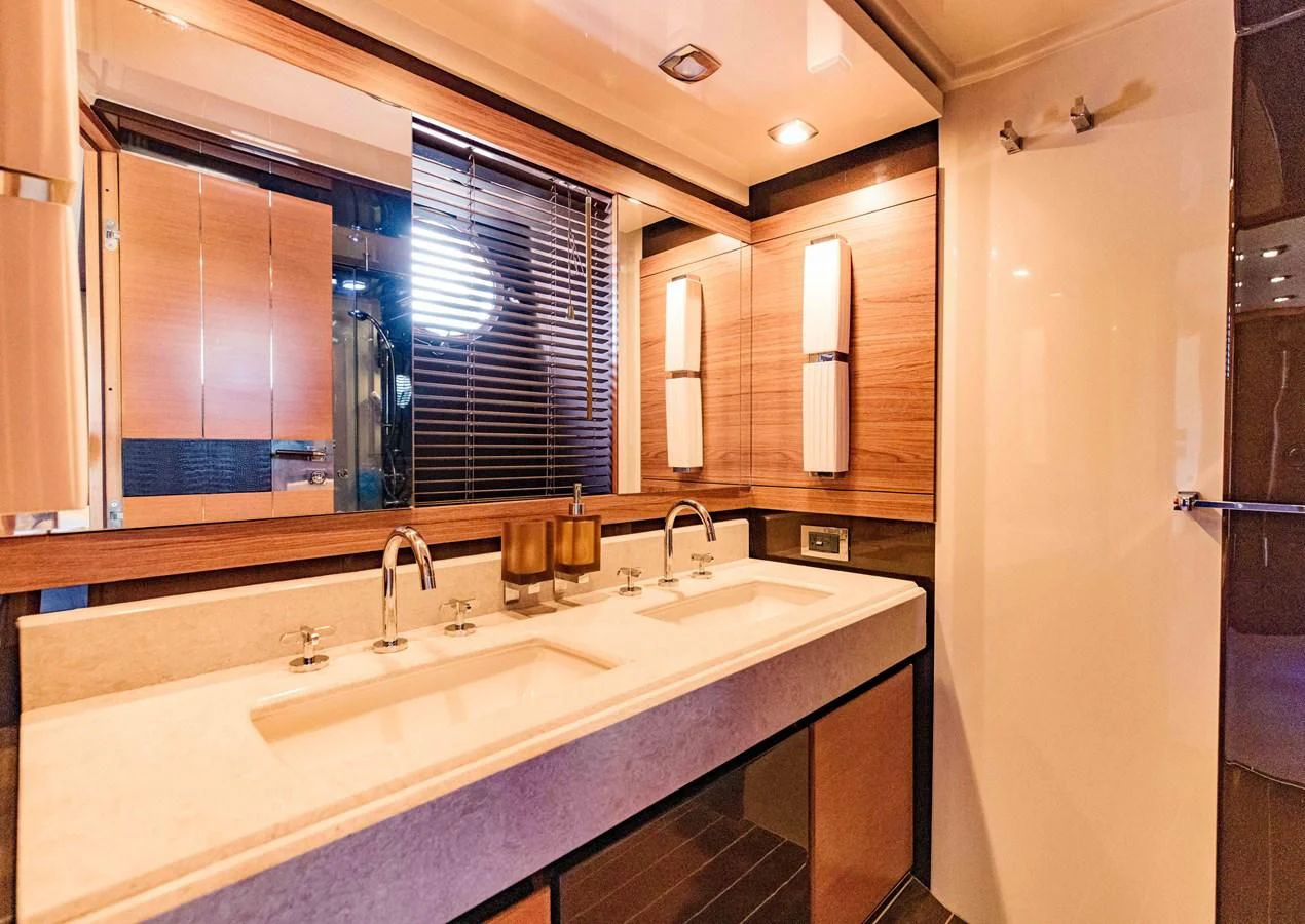 a bathroom with a large mirror aboard SYLVIA VI Yacht for Sale