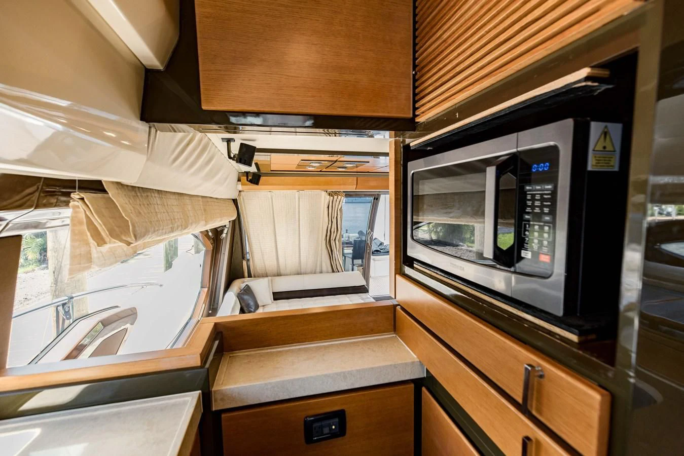 a kitchen with a microwave oven aboard SYLVIA VI Yacht for Sale