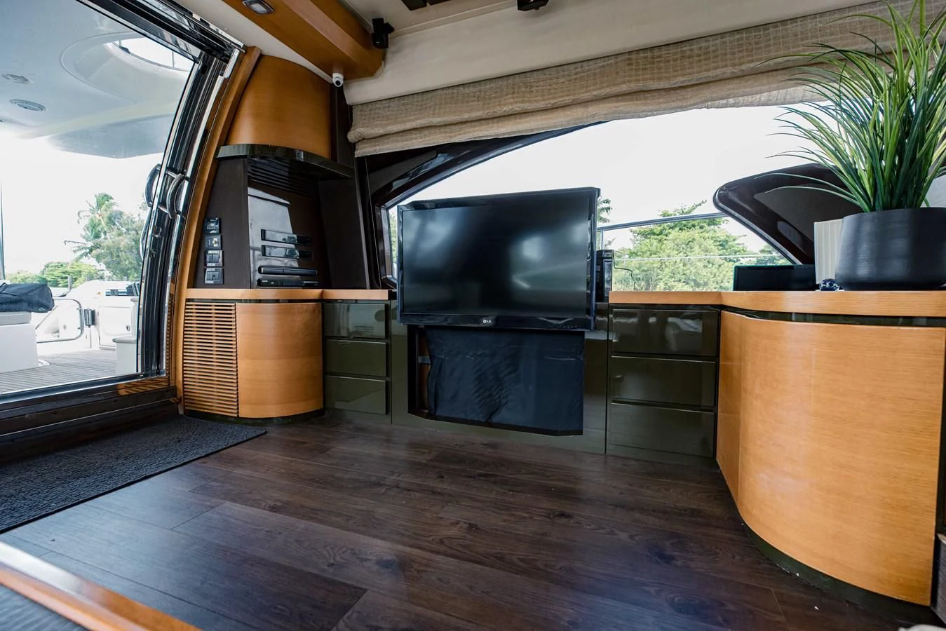 a living room with a tv aboard SYLVIA VI Yacht for Sale
