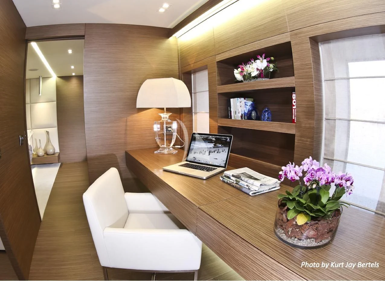 a living room with a laptop and a lamp aboard IPANEMAS Yacht for Sale