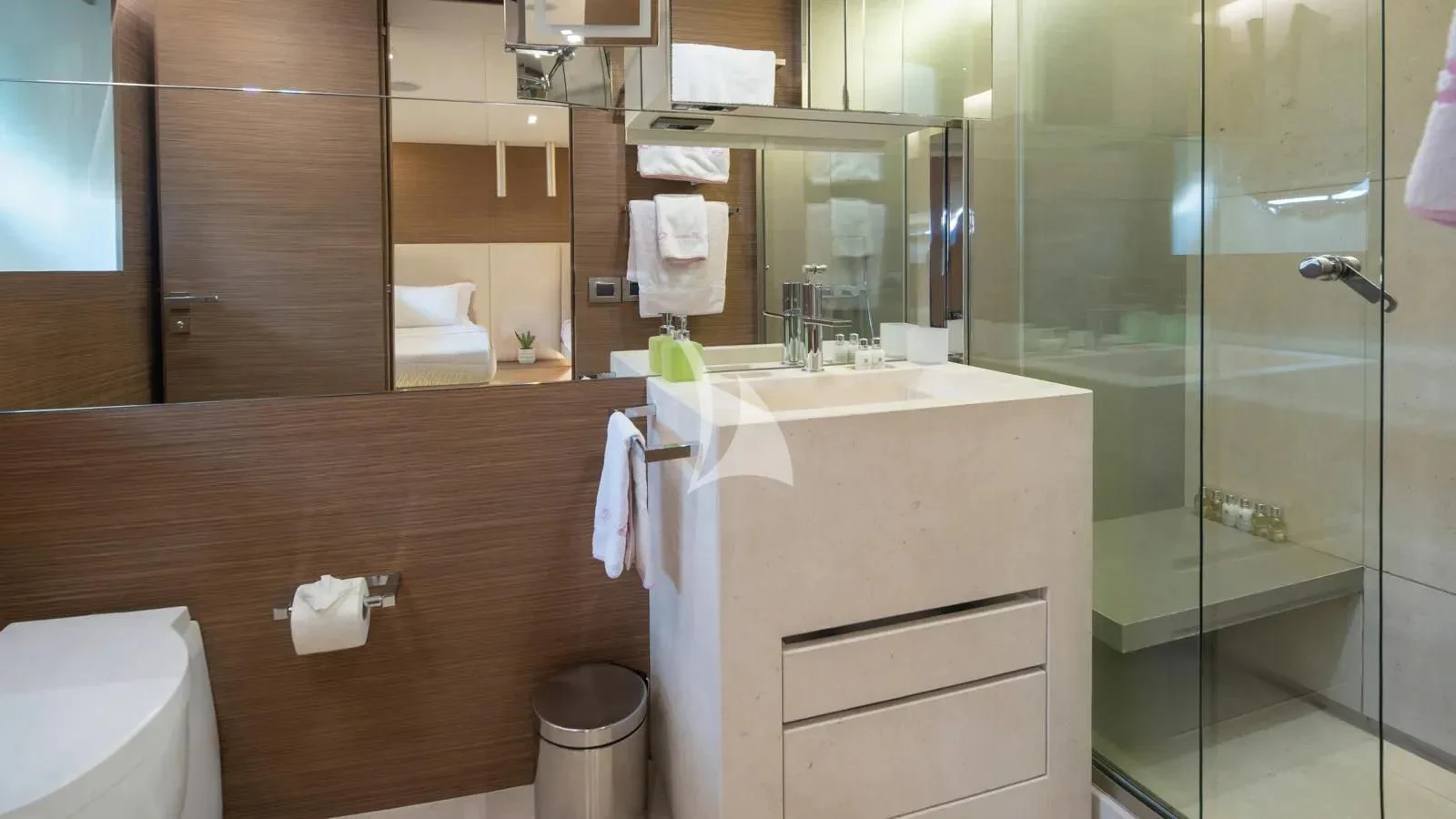 a bathroom with a glass shower aboard IPANEMAS Yacht for Sale