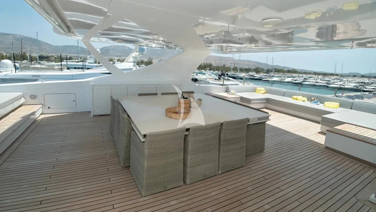 a room with a table and chairs aboard IPANEMAS Yacht for Sale