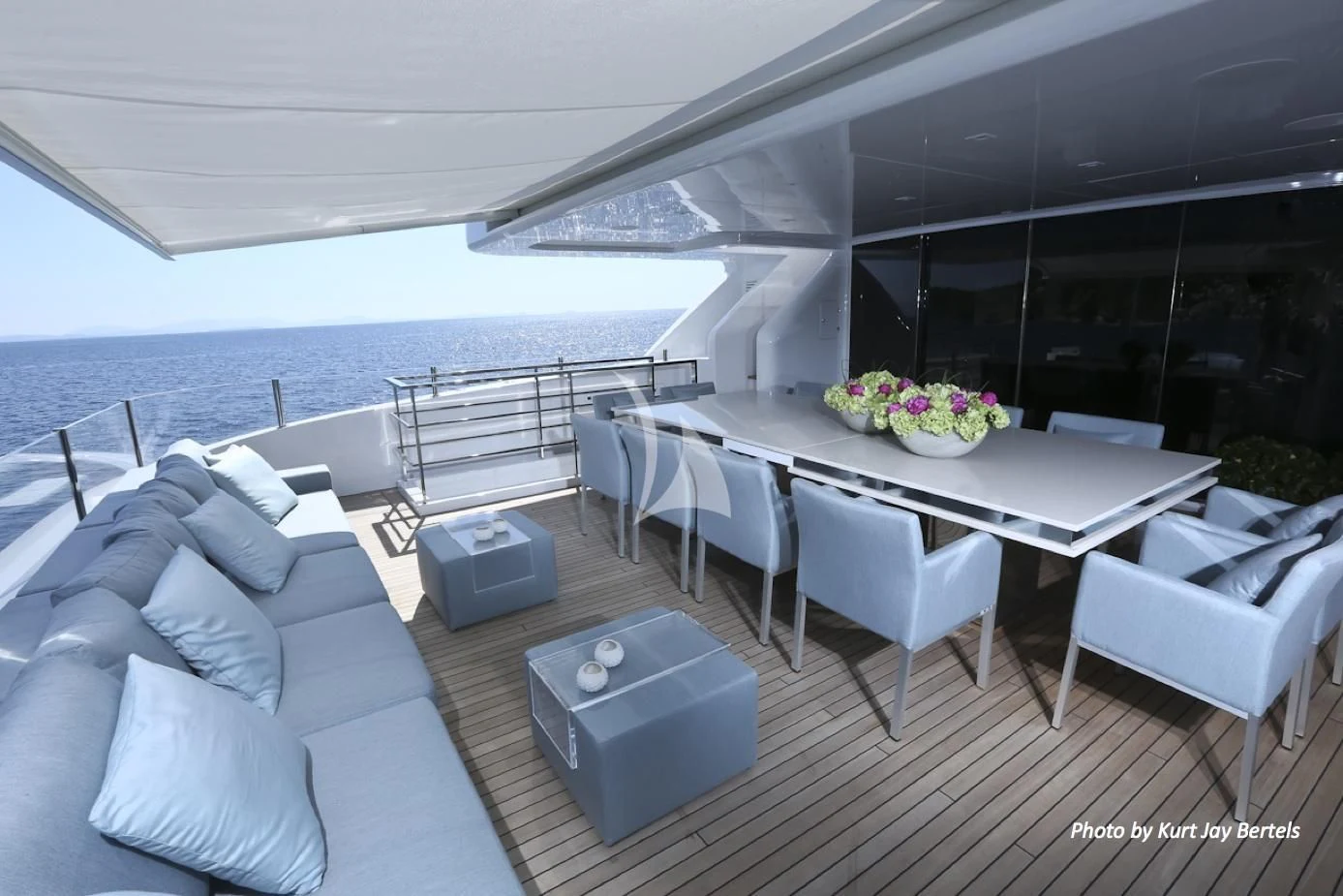 a large room with a table and chairs aboard IPANEMAS Yacht for Sale