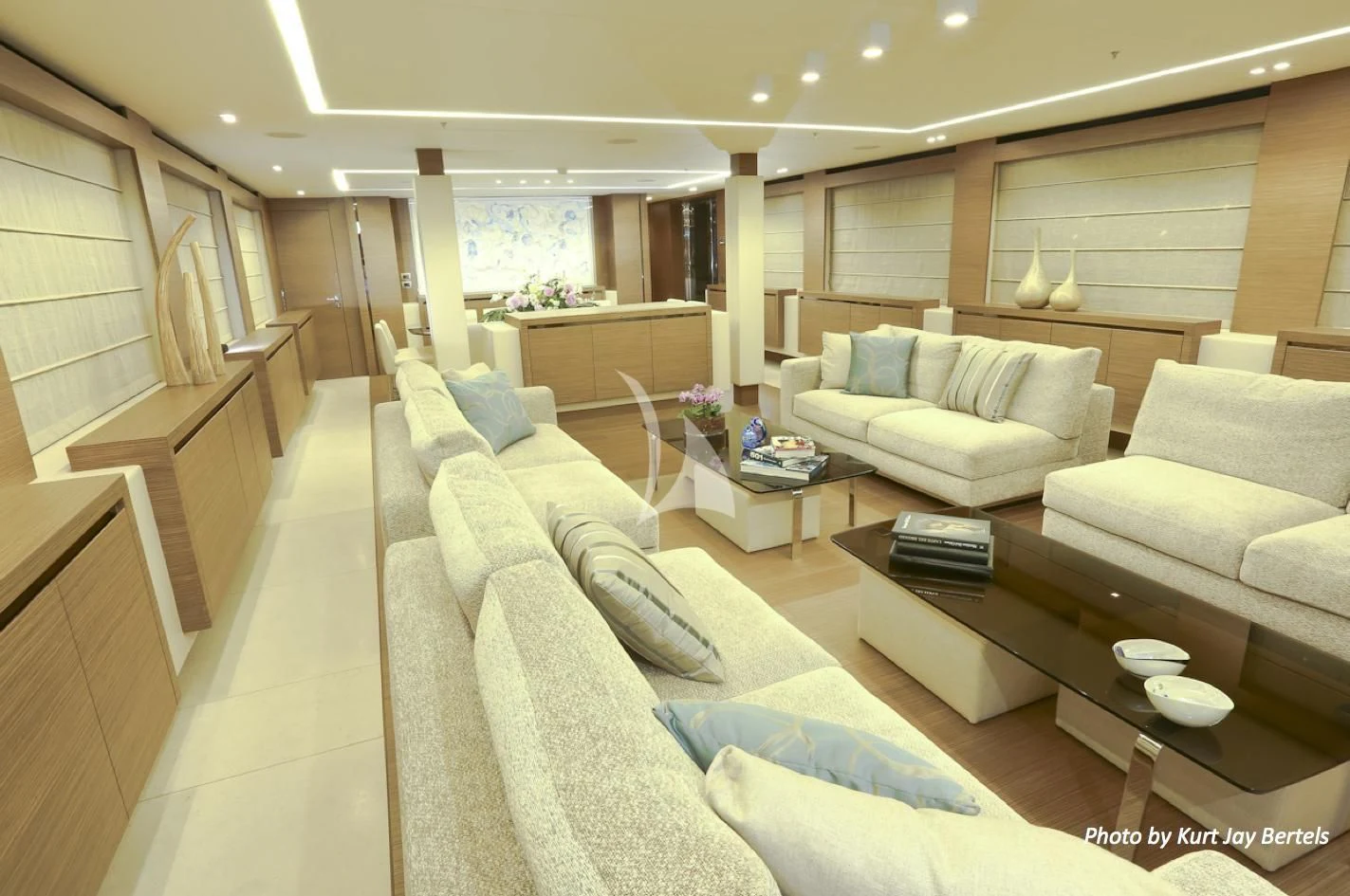 a living room with a couch and a coffee table aboard IPANEMAS Yacht for Sale