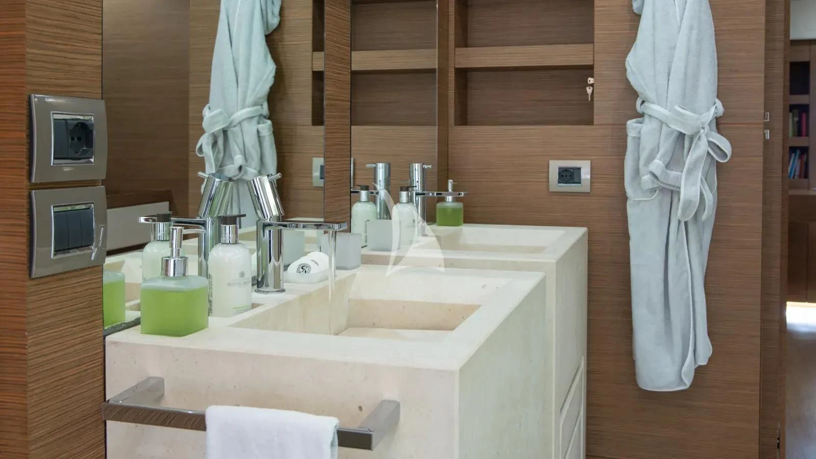 a bathroom with a sink and a towel on the wall aboard IPANEMAS Yacht for Sale