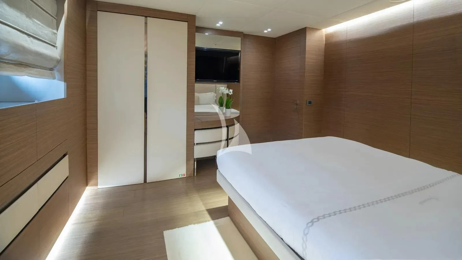 a room with a bed and a table aboard IPANEMAS Yacht for Sale