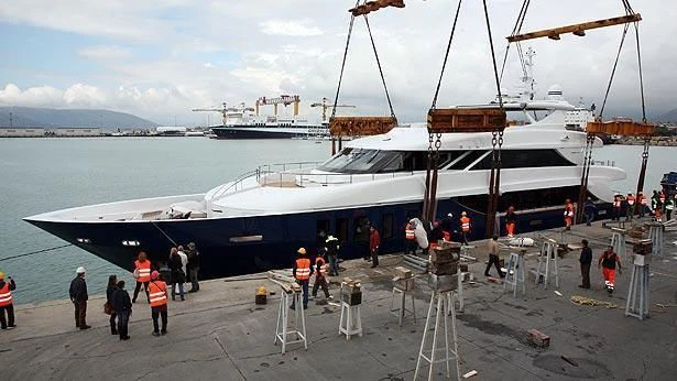 a large ship docked at a pier aboard IPANEMAS Yacht for Sale