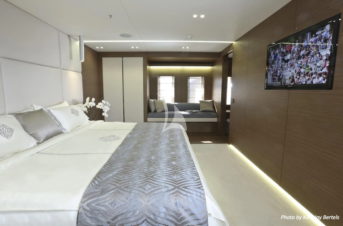 a hotel room with a bed and a couch aboard IPANEMAS Yacht for Sale
