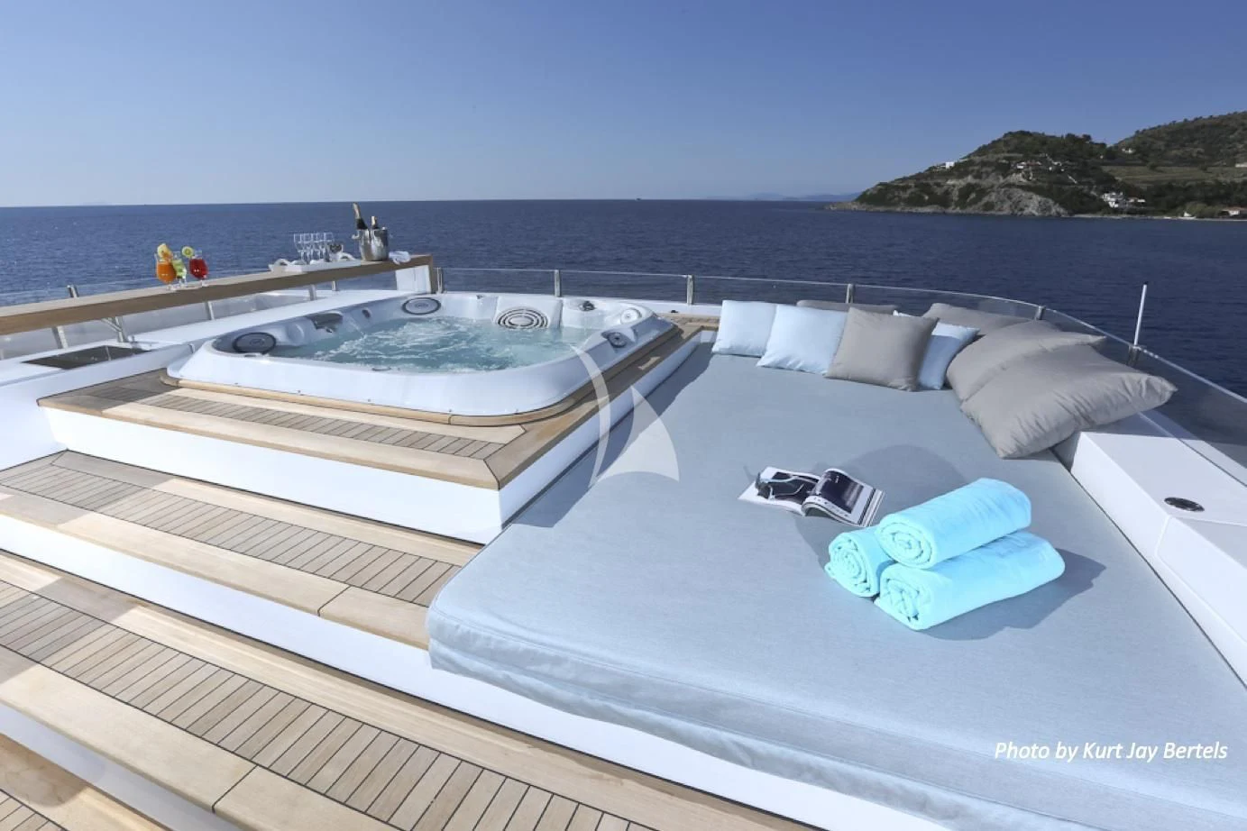 a rooftop with a pool and a view of the ocean aboard IPANEMAS Yacht for Sale