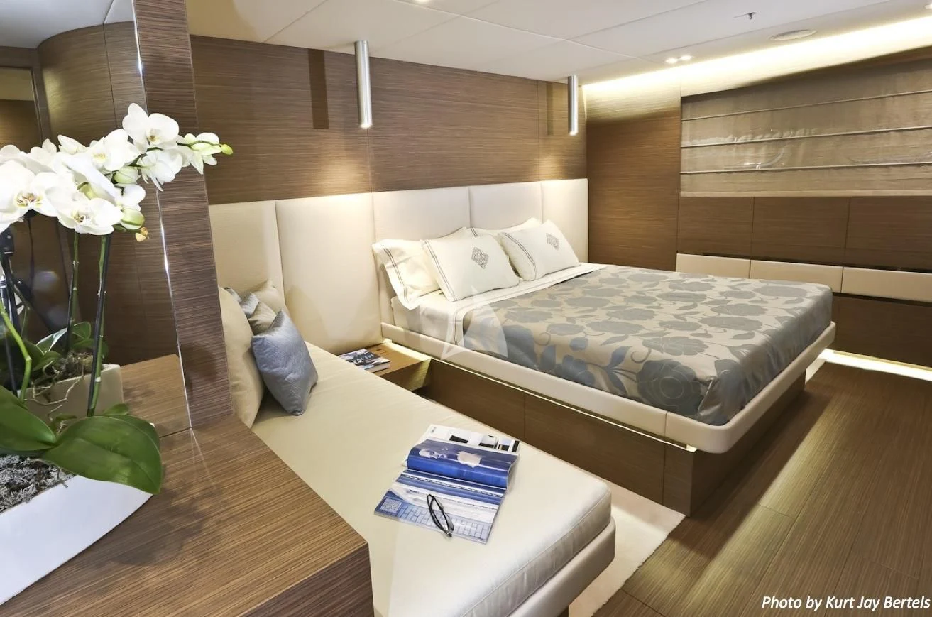 a room with a bed and a plant aboard IPANEMAS Yacht for Sale