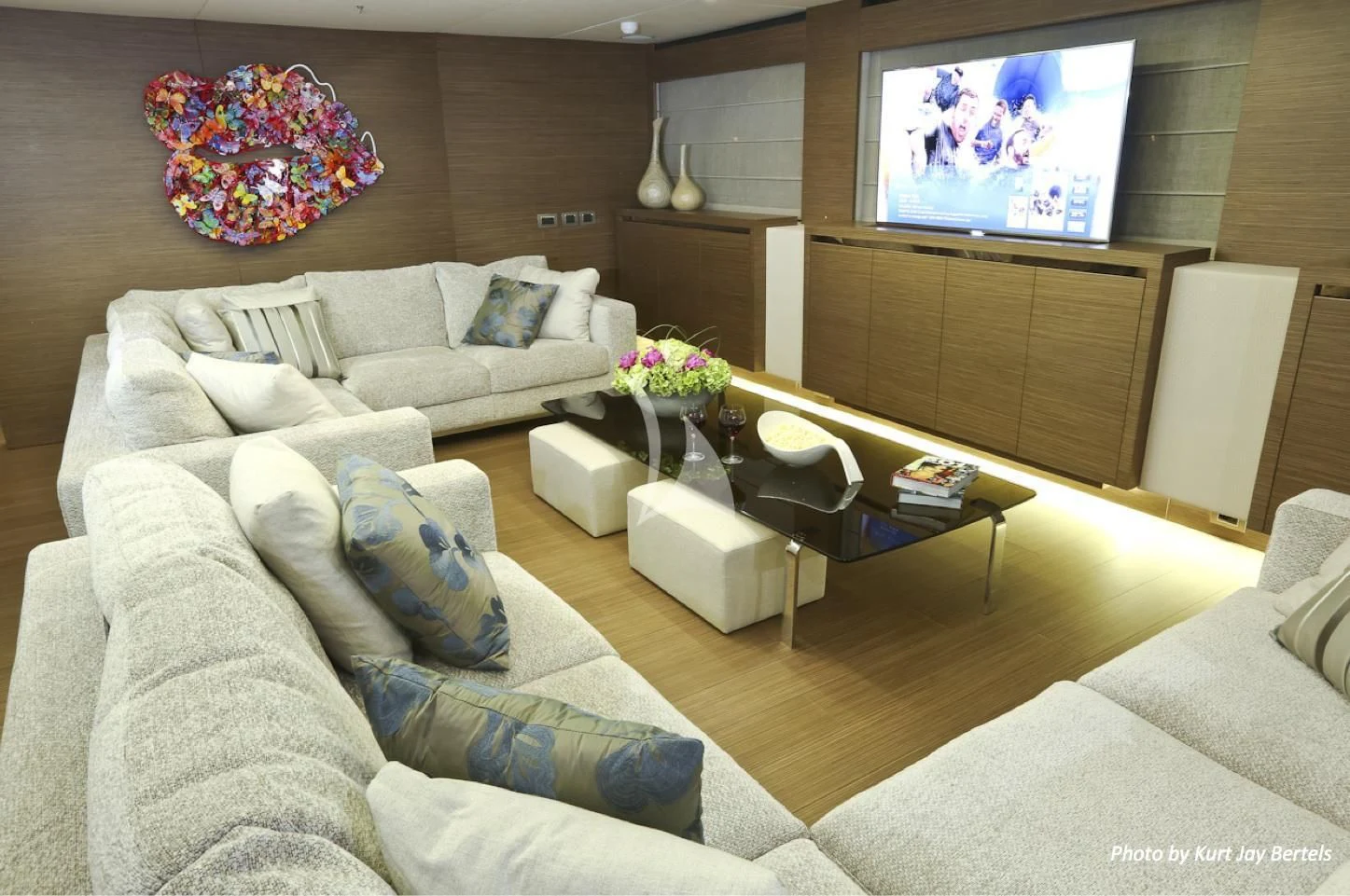 a living room with a large screen aboard IPANEMAS Yacht for Sale