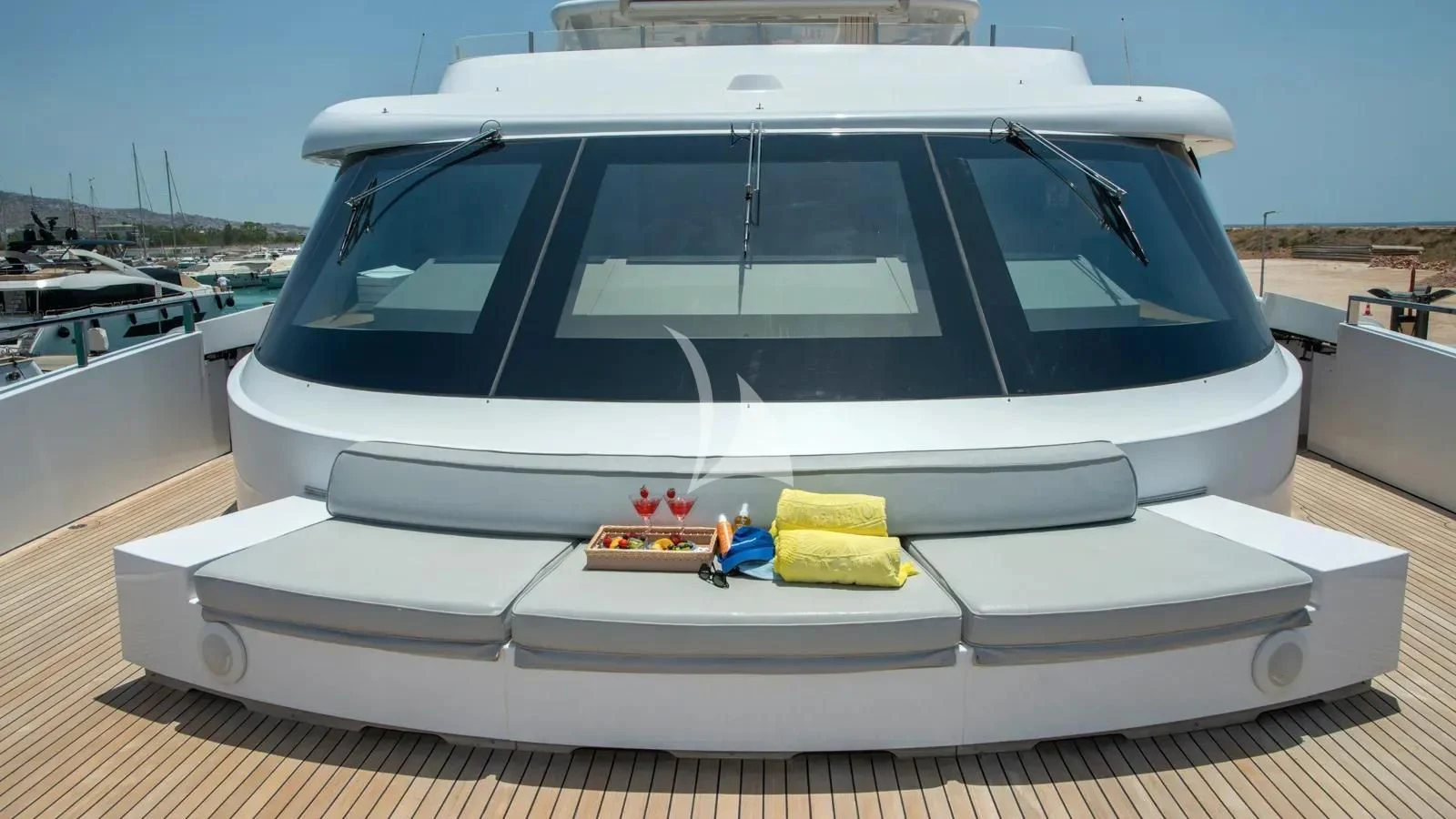 a white yacht with a yellow towel on the front aboard IPANEMAS Yacht for Sale