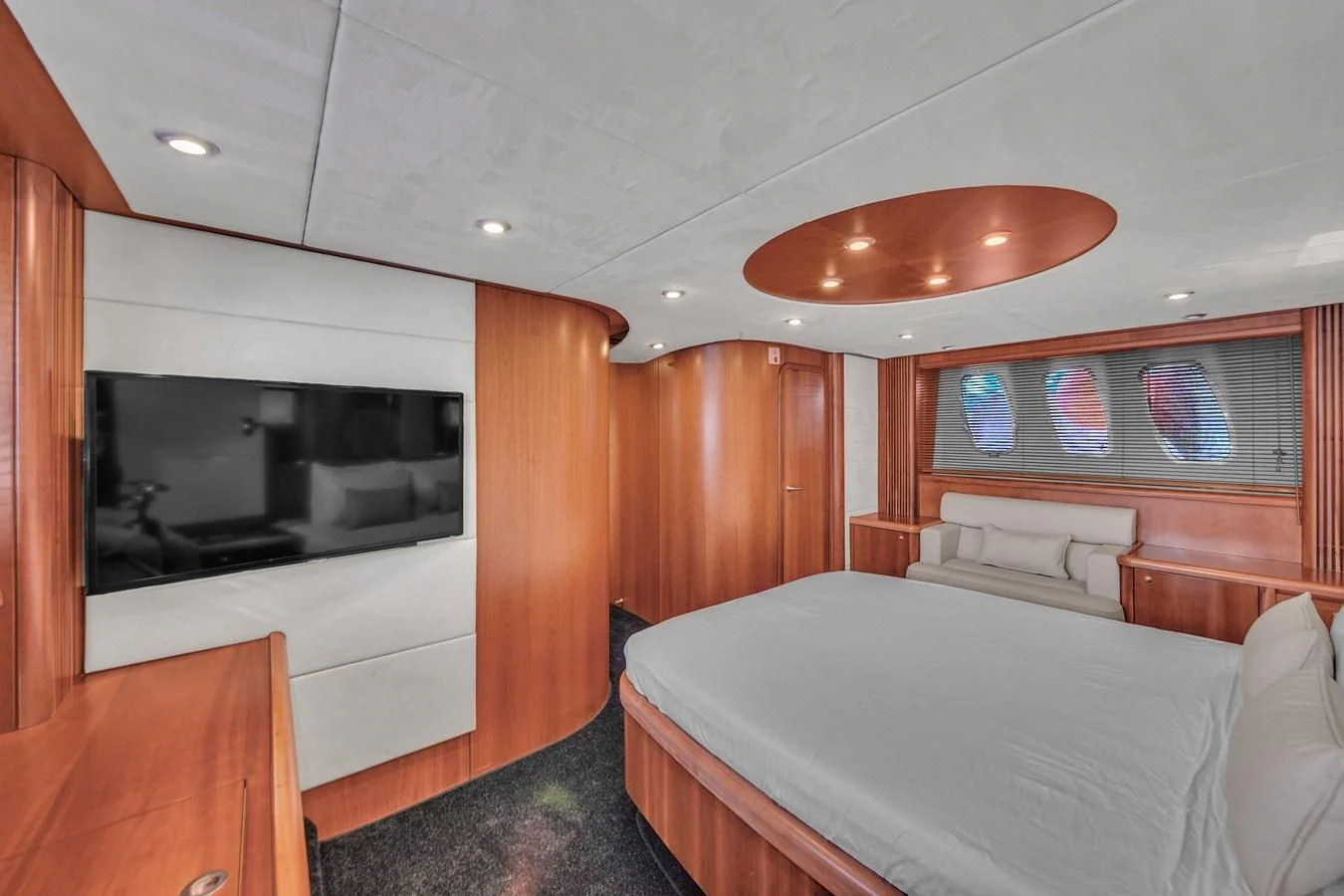 a bedroom with a bed and a television aboard 82' SUNSEEKER PREDATOR 82 Yacht for Sale