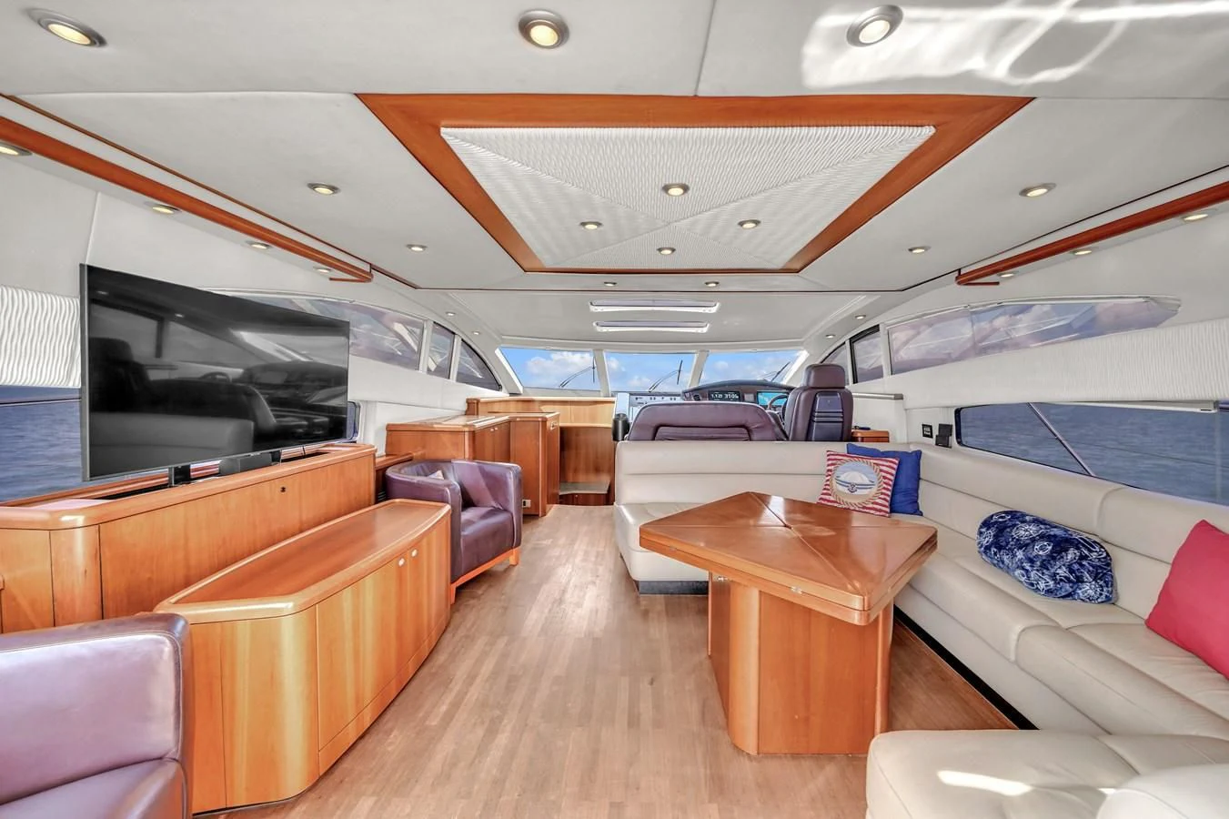 a living room with a large television aboard 82' SUNSEEKER PREDATOR 82 Yacht for Sale