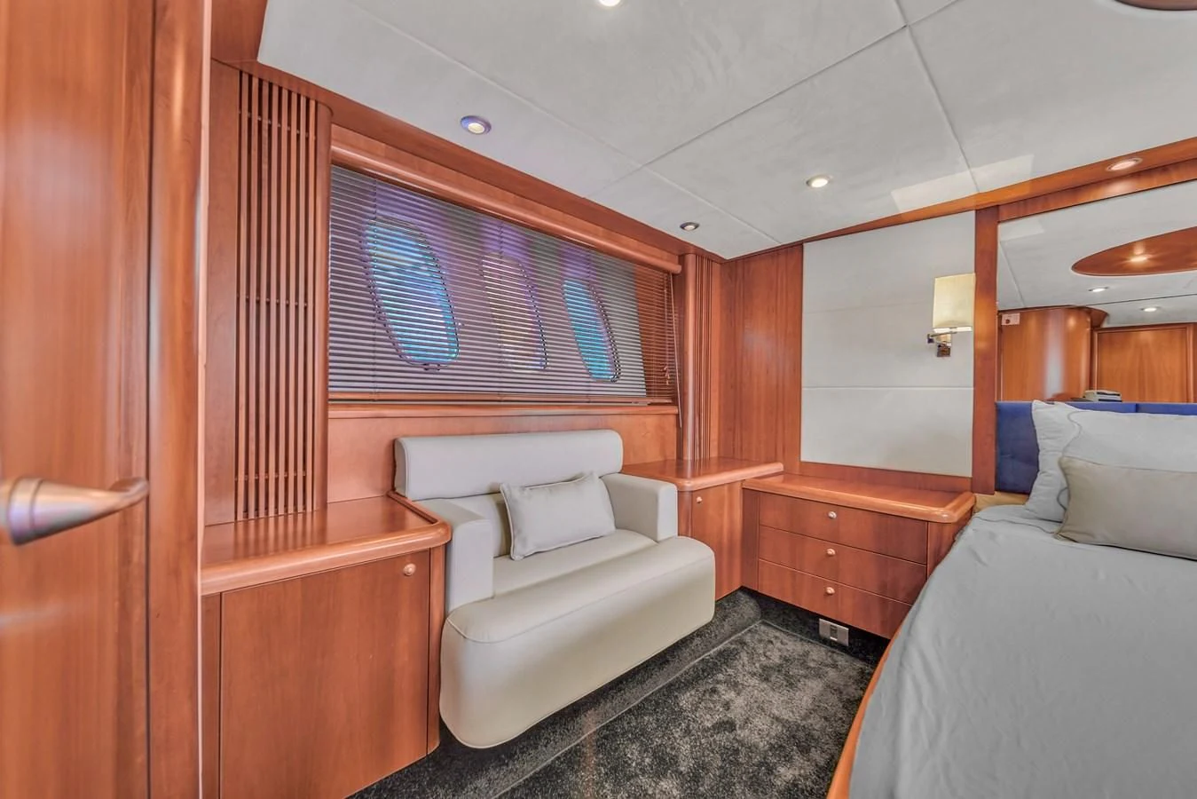a room with a bed and a couch aboard 82' SUNSEEKER PREDATOR 82 Yacht for Sale