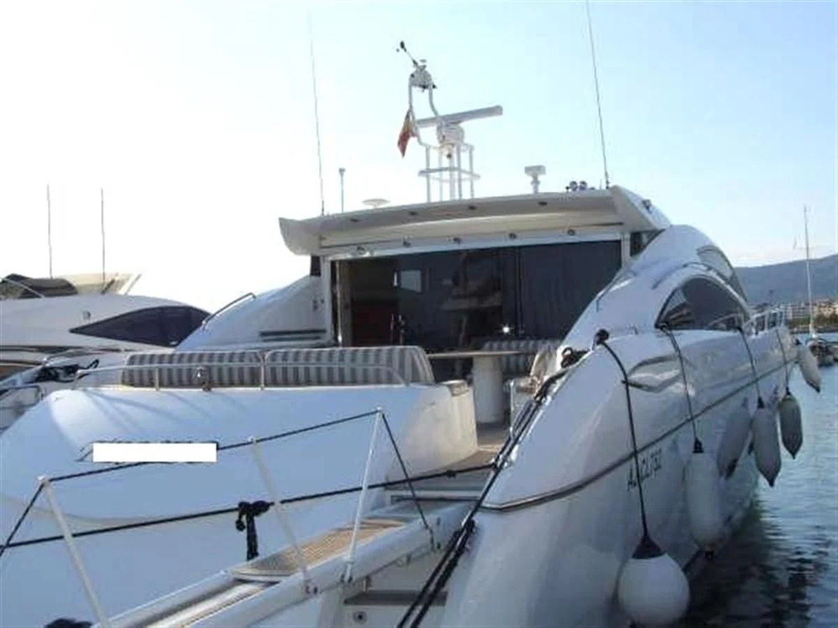 a boat with a wind turbine aboard 82' SUNSEEKER PREDATOR 82 Yacht for Sale