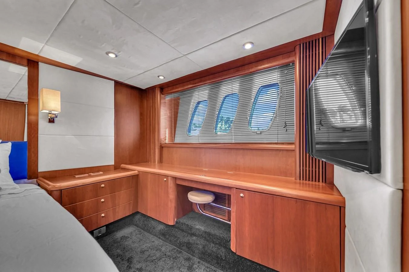 a room with a bed and a window aboard 82' SUNSEEKER PREDATOR 82 Yacht for Sale