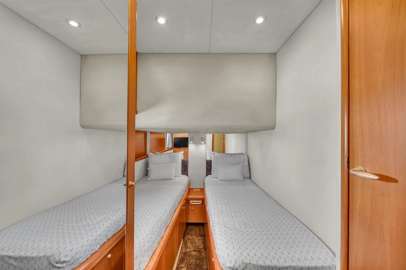 a room with two beds aboard 82' SUNSEEKER PREDATOR 82 Yacht for Sale