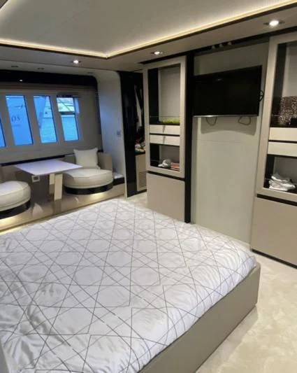 a bedroom with a large bed aboard FREE MIND Yacht for Sale