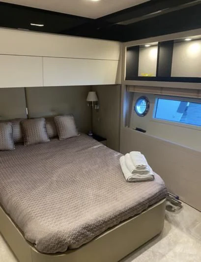 a bed in a room aboard FREE MIND Yacht for Sale