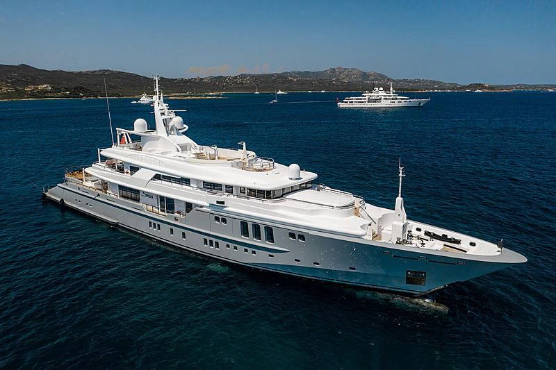 a large white boat in the water aboard SIREN Yacht for Sale