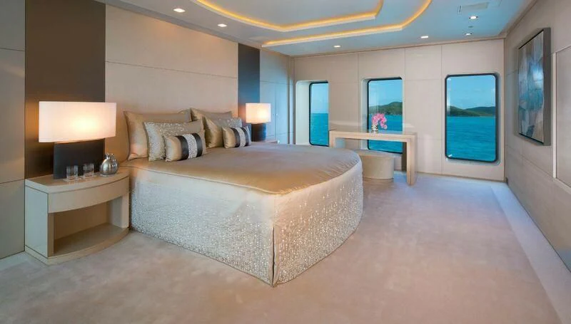 a large bed in a hotel room aboard SIREN Yacht for Sale