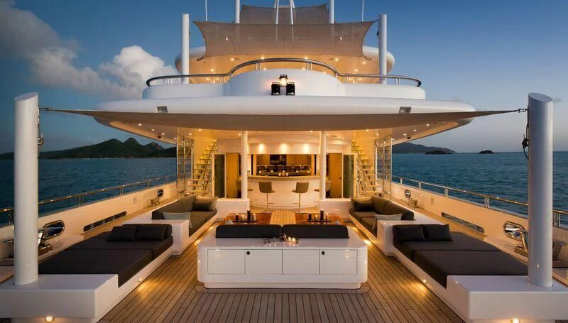 a large ship in the water aboard SIREN Yacht for Sale