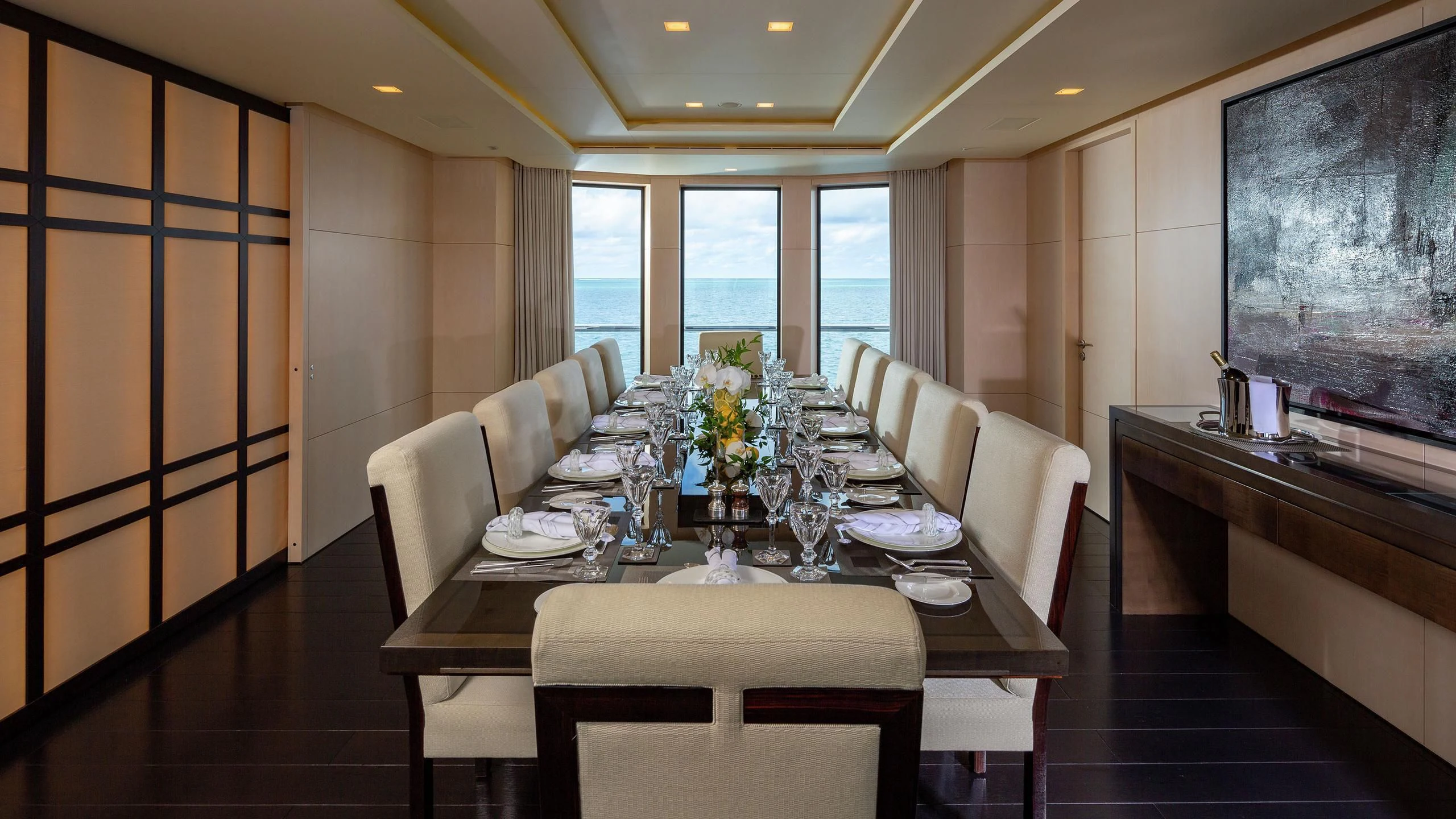 a dining room with a table and chairs aboard SIREN Yacht for Sale