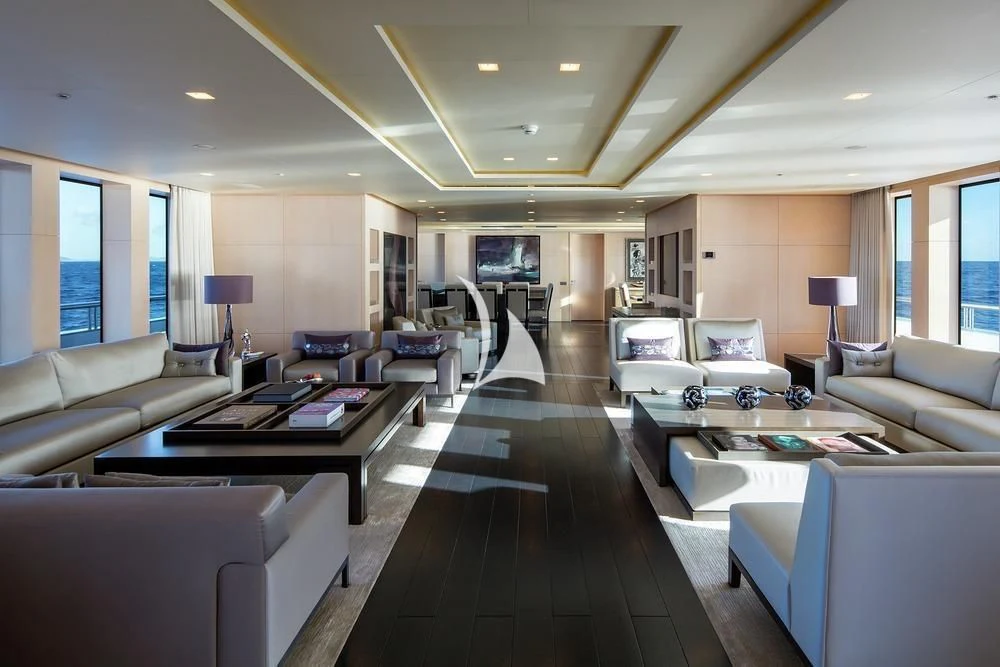 a living room with a large window aboard SIREN Yacht for Sale