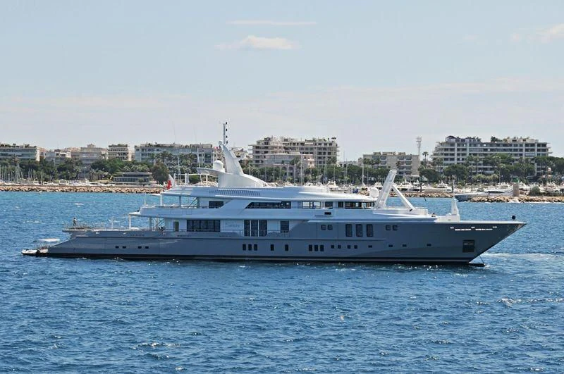 a large white boat in the water aboard SIREN Yacht for Sale