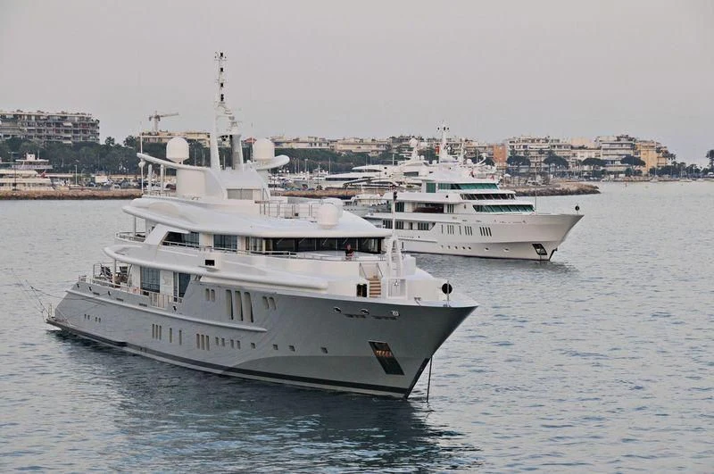 a couple of white boats in the water aboard SIREN Yacht for Sale
