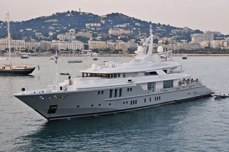 a large white boat in the water aboard SIREN Yacht for Sale