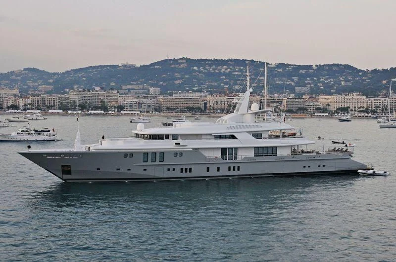 a large white boat in the water aboard SIREN Yacht for Sale